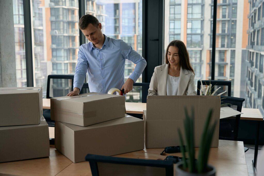 Employees handling moving boxes